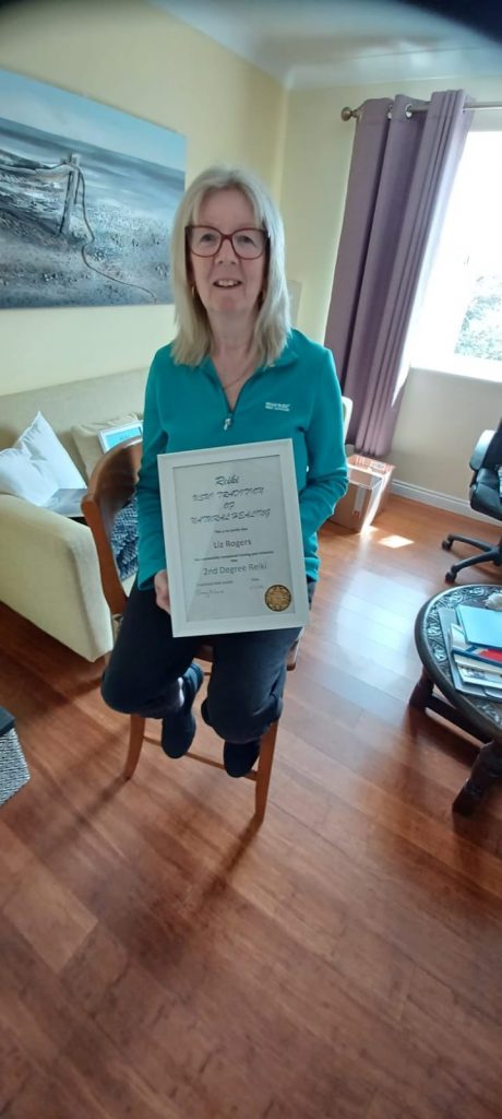L Rogers Passing her Reiki Training Level 2